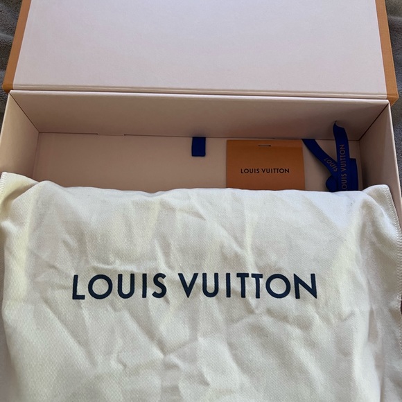 This is my black Louis Vuitton messenger bag, wore it one time perfectly good. - Picture 7 of 9